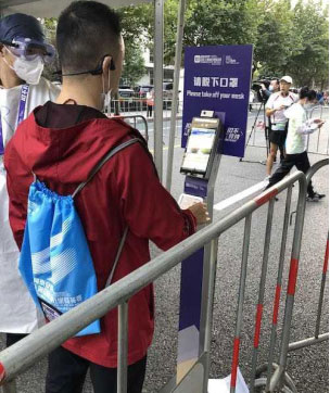 Utilisation du thermomètre infrarouge à reconnaissance faciale pour la « Course Élite de 10 km de Shanghai » 60406f32c5fc2.jpg